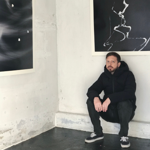 Adam poses with his works at the exhibition “Anamnesis” at Gallery Woolim in Seoul in February 2020.